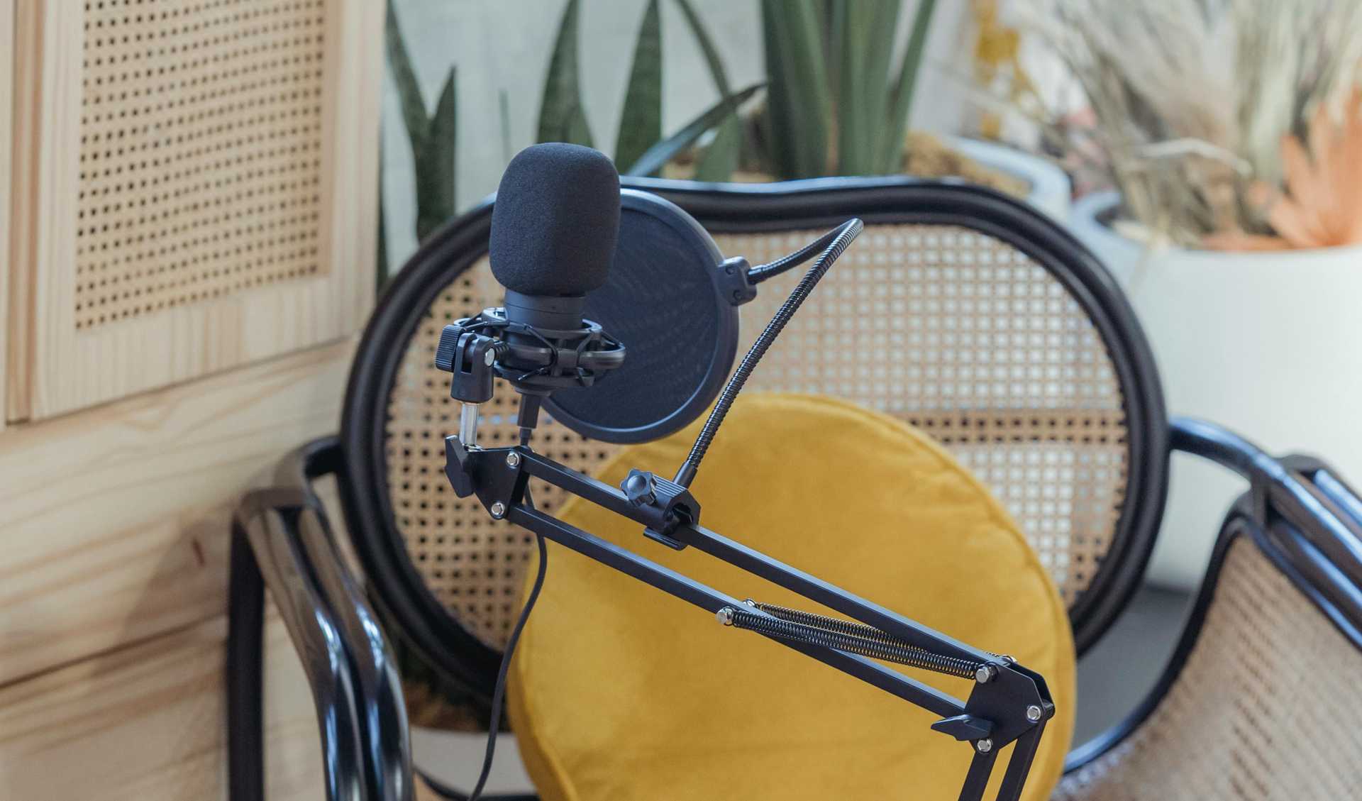 Laptop and microphone in front of a chair