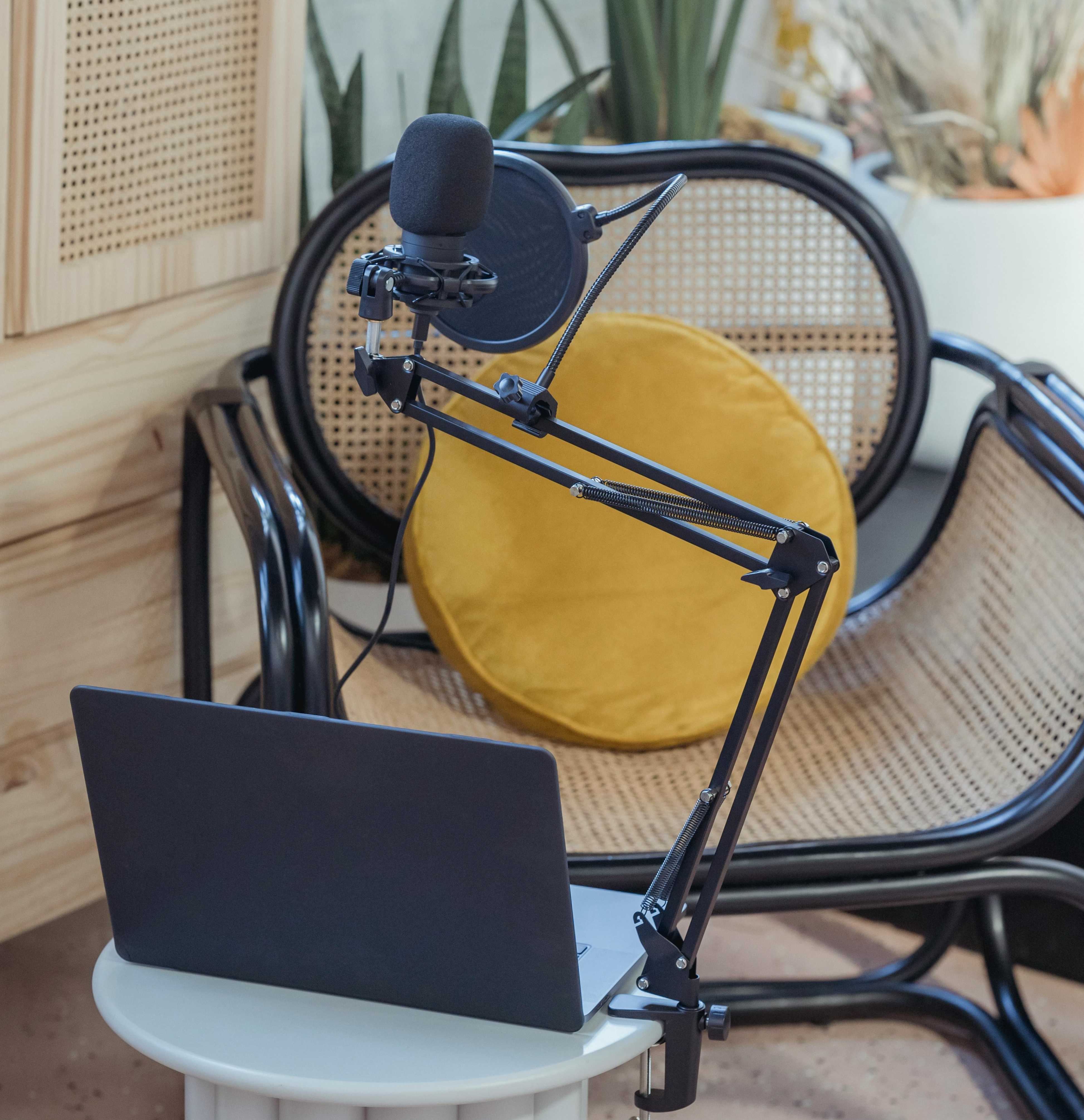 Laptop and microphone in front of a chair