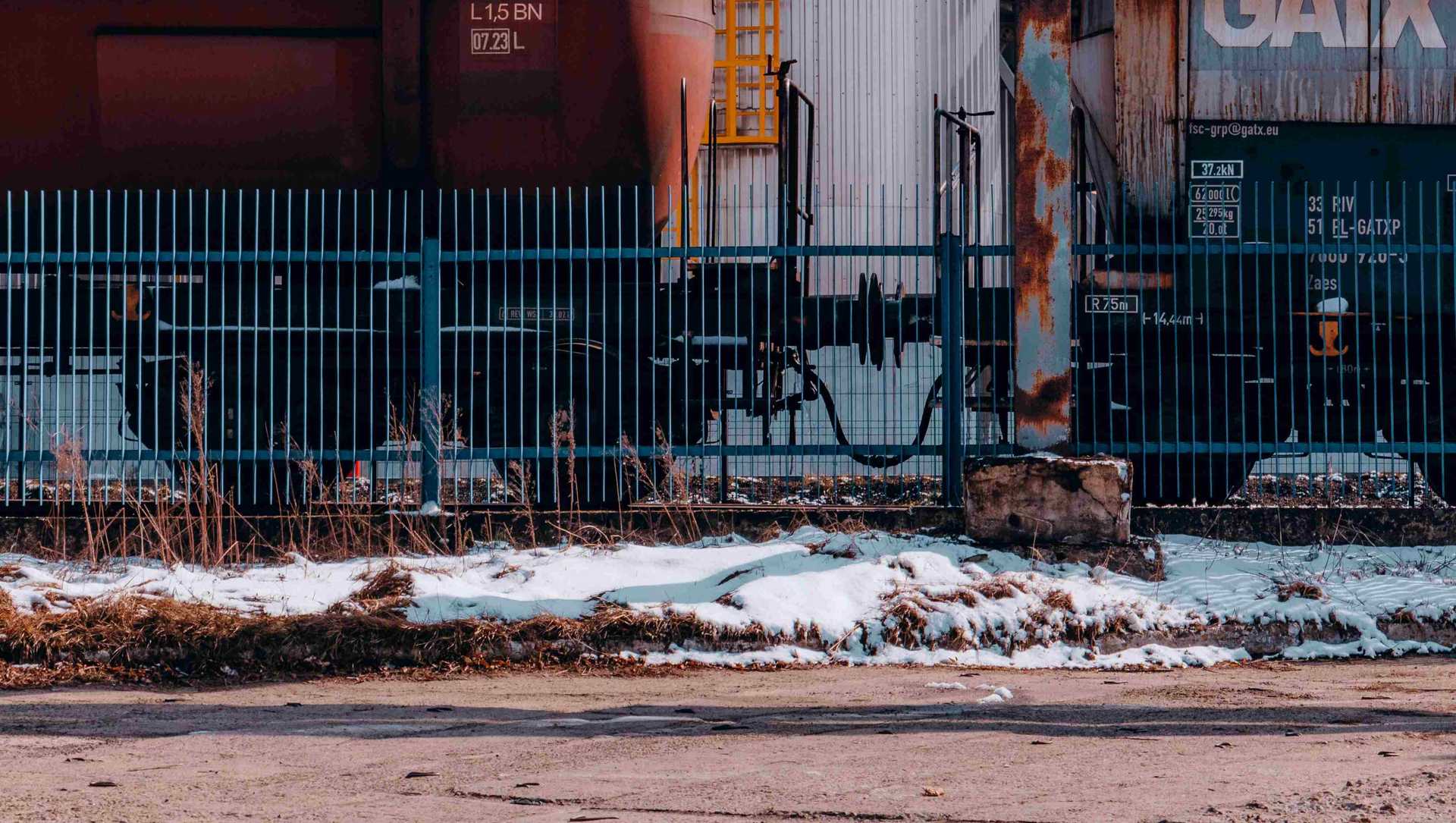 Tanker cars in front of a refinery
