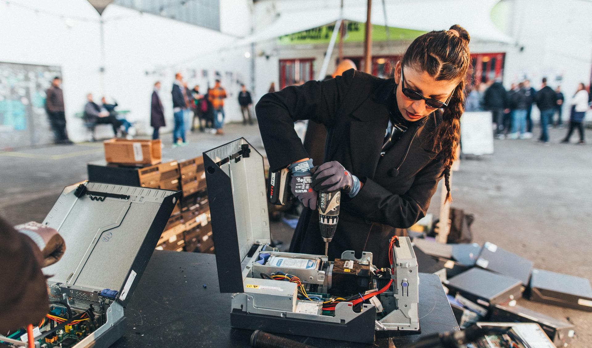 The artist is deconstructing motherboards during a exhibition