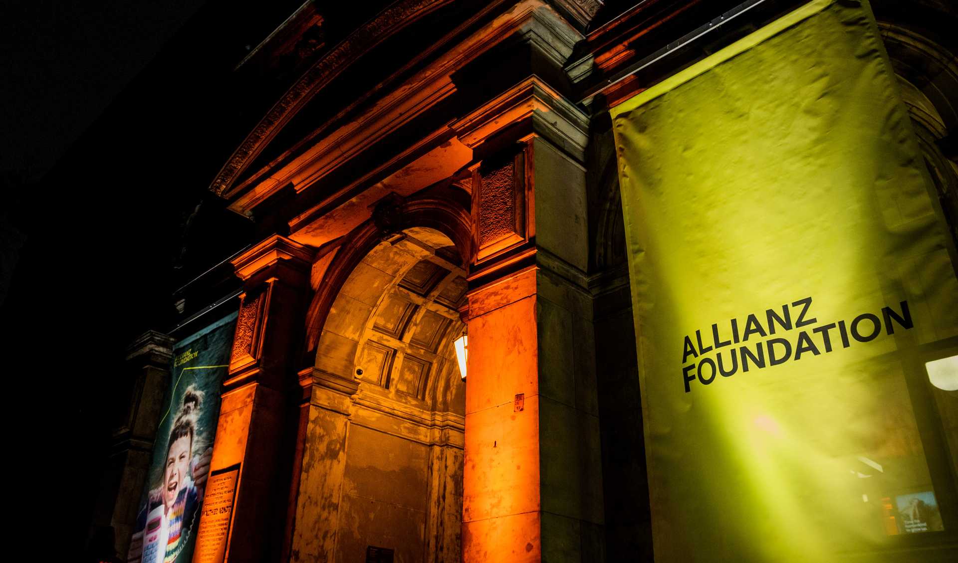  Museum of Natural History from the outside with a yellow Allianz Foundation banner