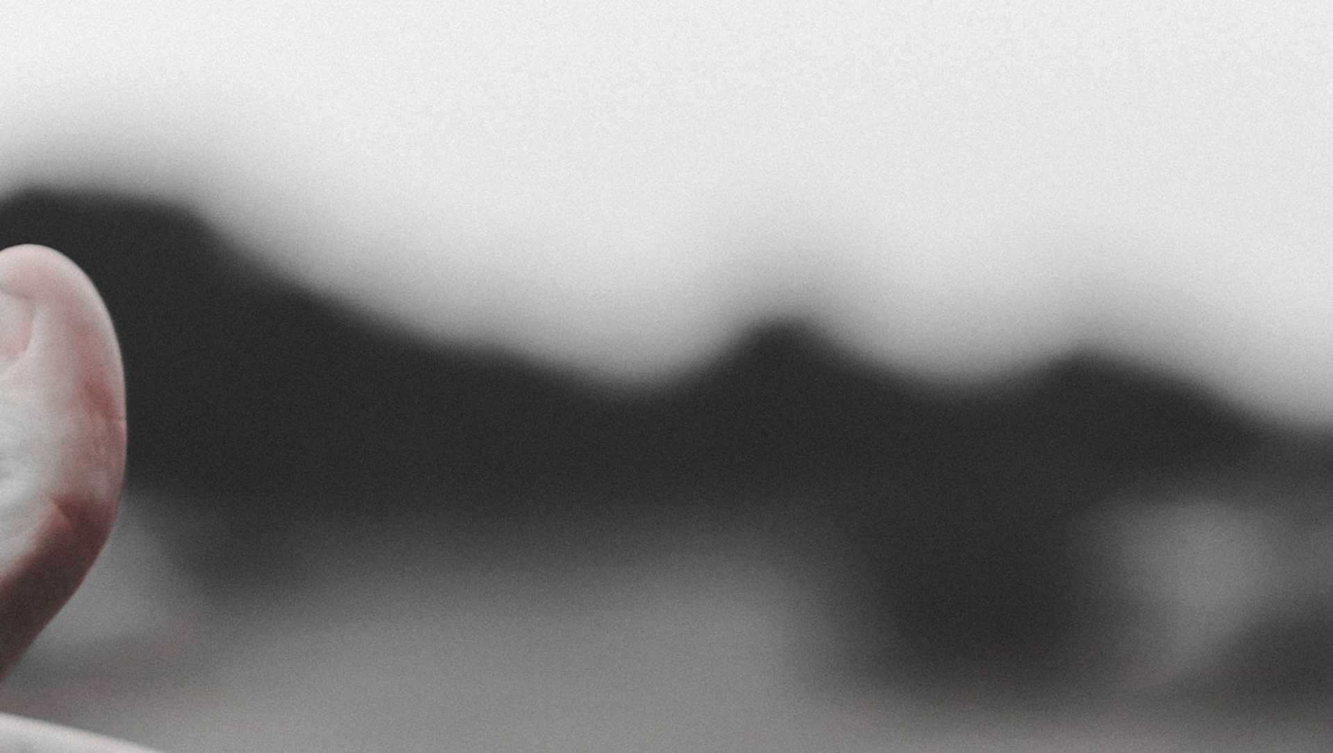 A finger with a sticker on the tip saying "I voted".