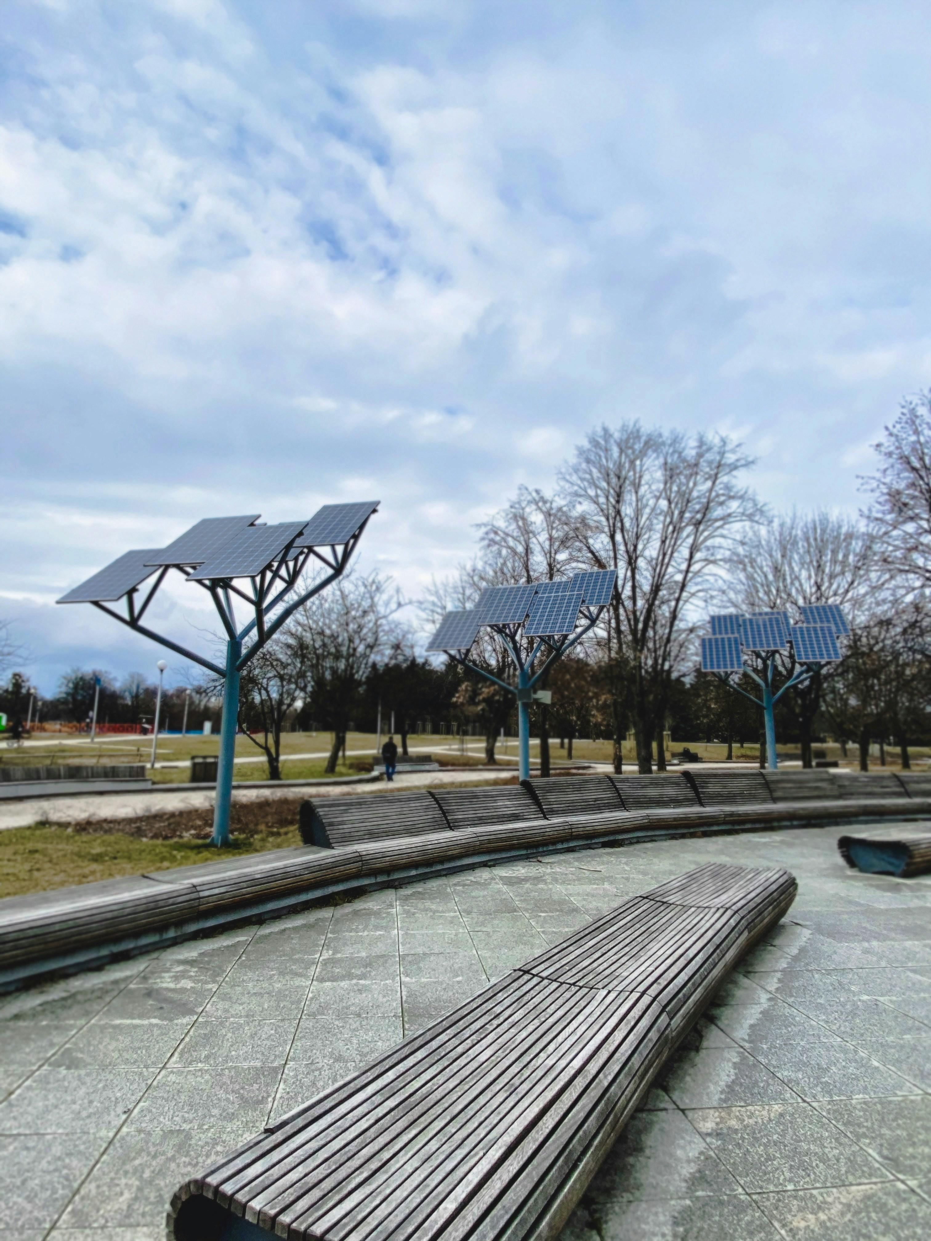 A park in Warsaw, Poland. There are long wooden branches and sun collectors installed in the park.