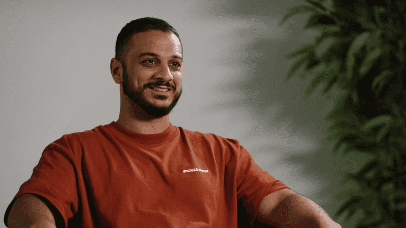 Younes Al-Amayra is smiling into the camera