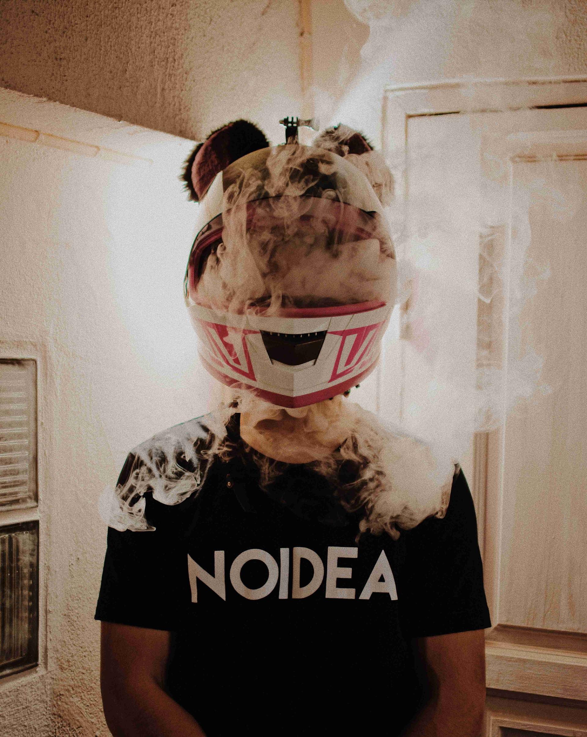 A man with a helmet that is filled with smoke