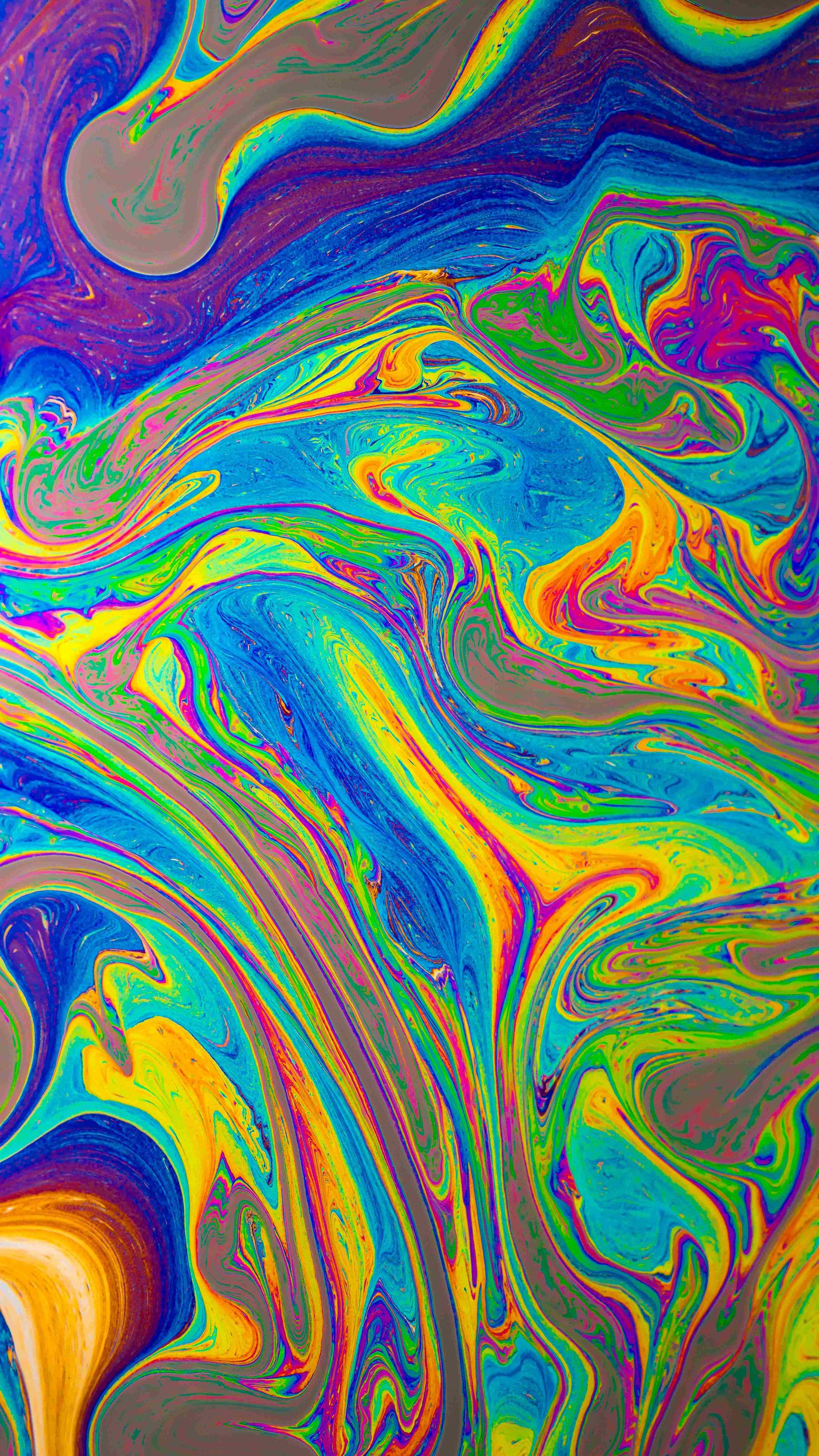 Oil on water is creating a colorful picture.